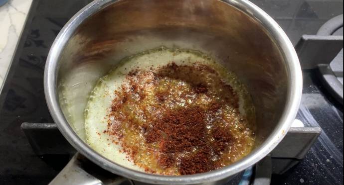 Melting butter with spice powder over gentle heat
