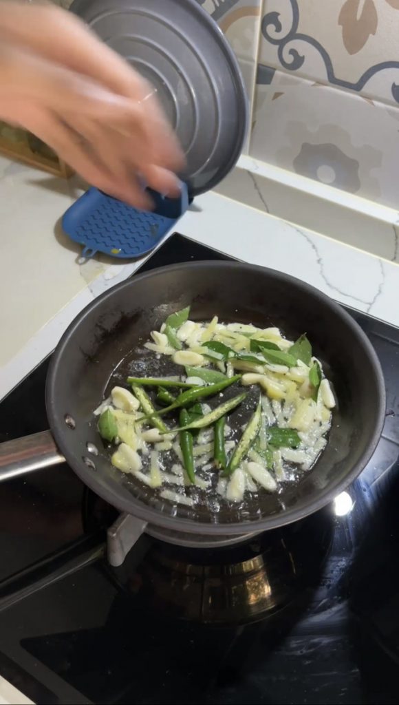 Fish Curry Cravers guide tempering spices to finish the curry